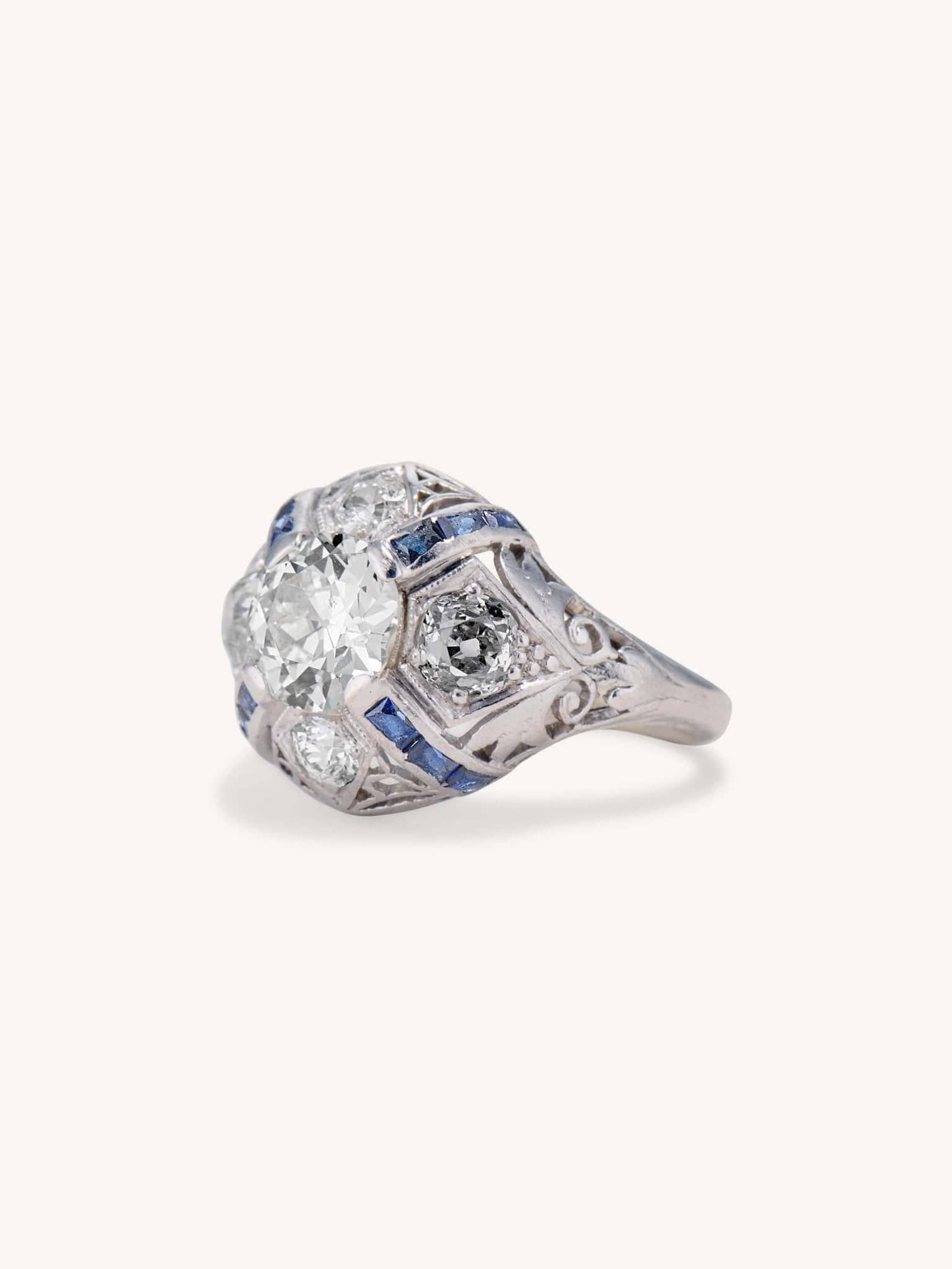Art Deco 1.25 Carat Old European Cut Diamond and Sapphire Bombé Vintage Engagement Ring - Image 2
